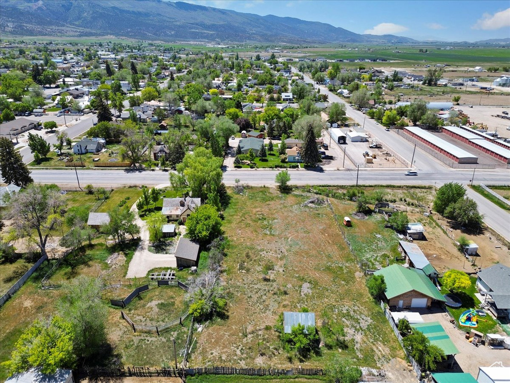 Aerial perspective of suburban area with a mountainous background