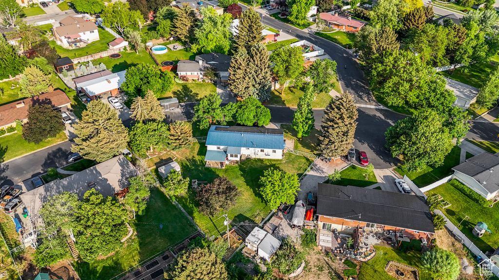 Aerial view of property's location with nearby suburban area