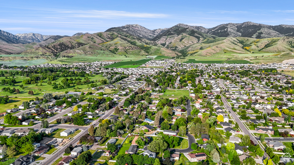 View of property location featuring a mountainous background and nearby suburban area