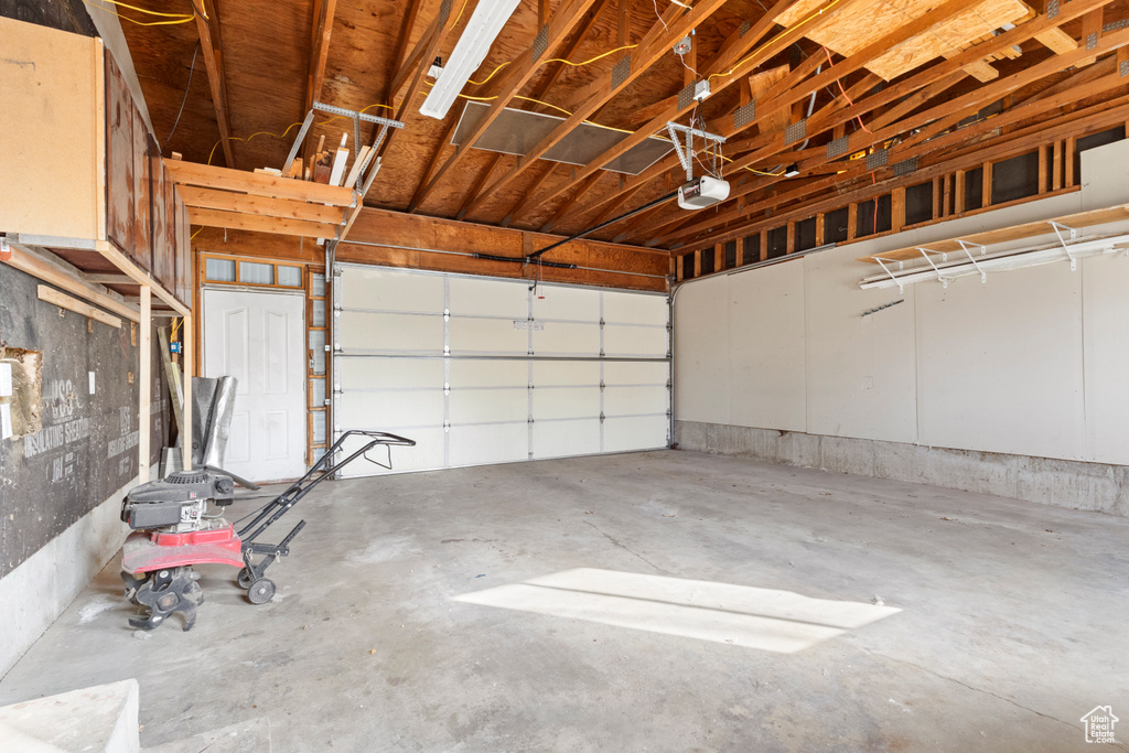 Garage featuring a garage door opener