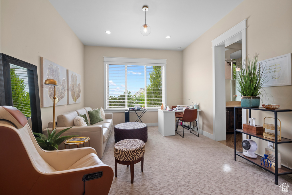 Sitting room featuring carpet, baseboards, and recessed lighting