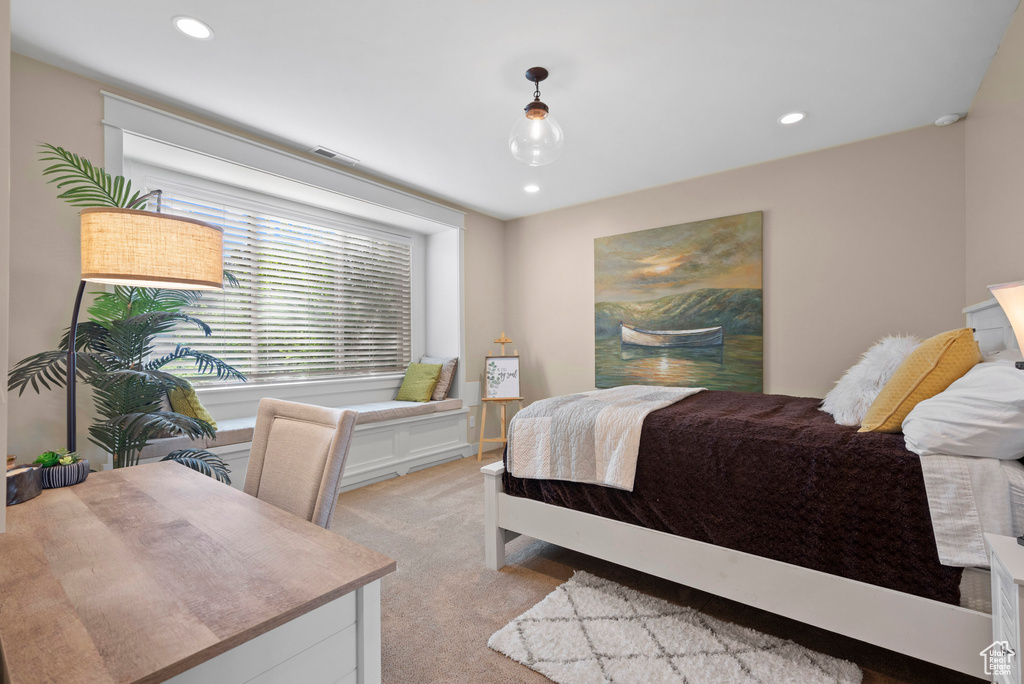Bedroom featuring light carpet and recessed lighting