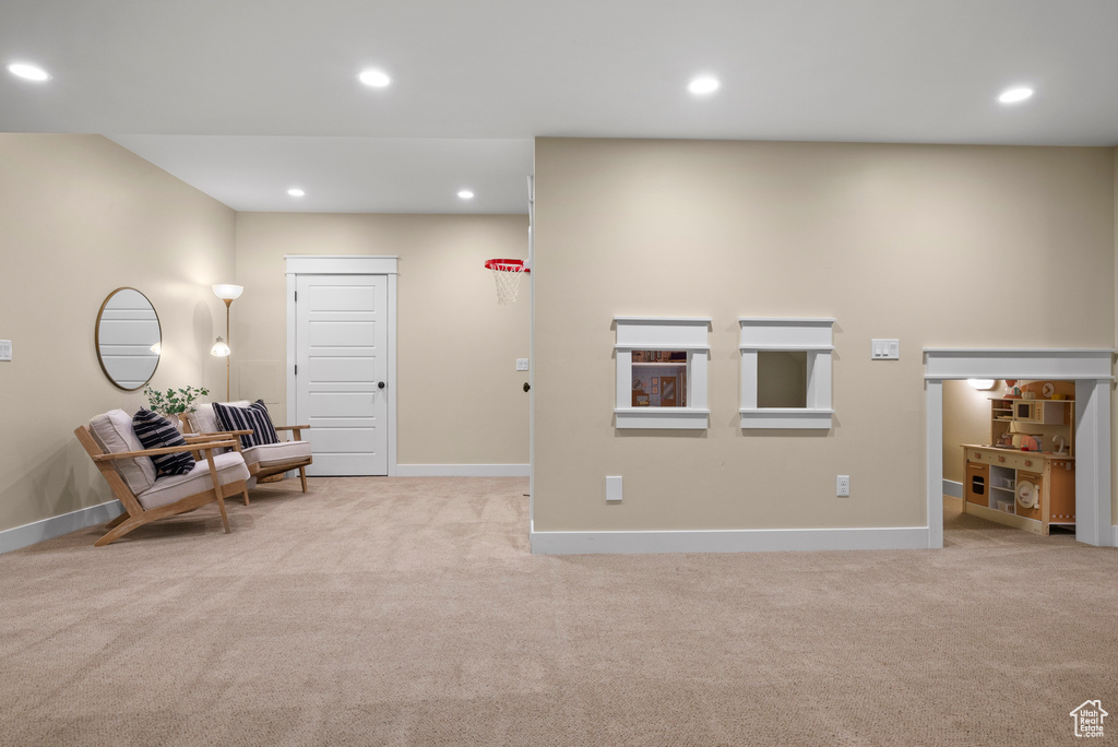 Sitting room with carpet flooring, recessed lighting, and baseboards