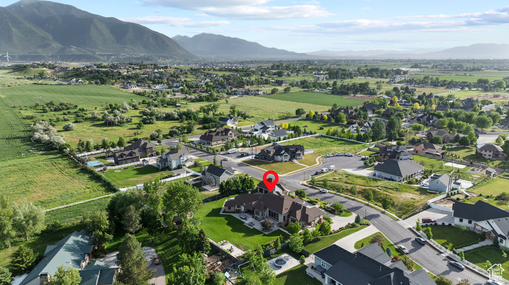 Aerial view of property and surrounding area with mountains