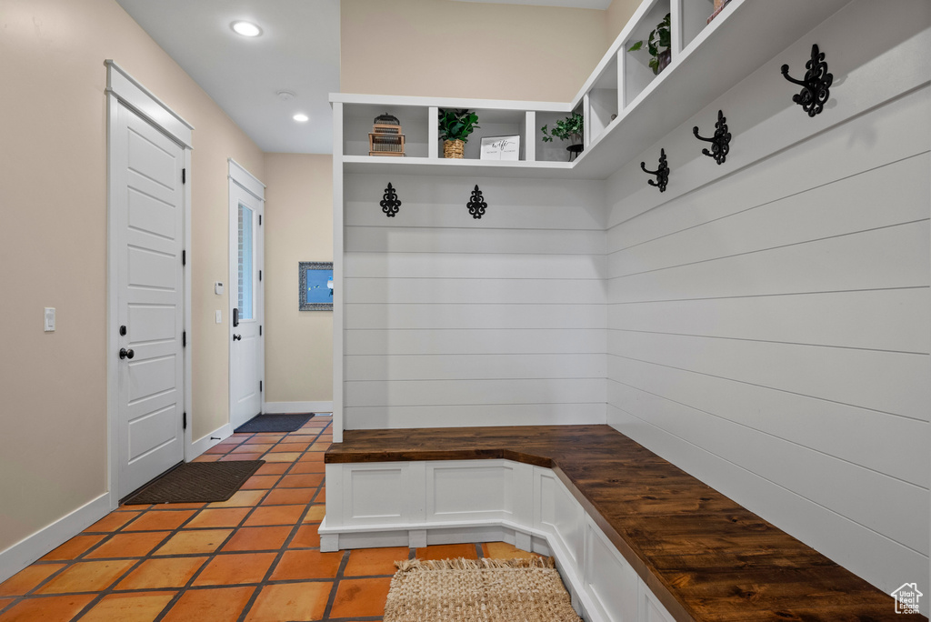 Mudroom featuring recessed lighting, baseboards, and light tile patterned floors