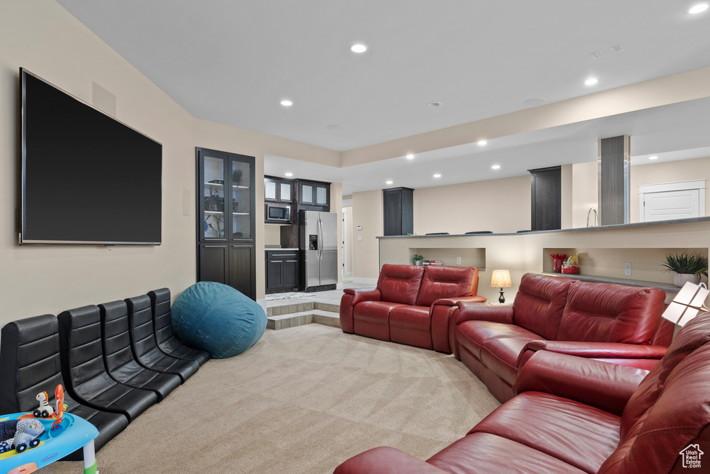 Living room featuring recessed lighting and light colored carpet