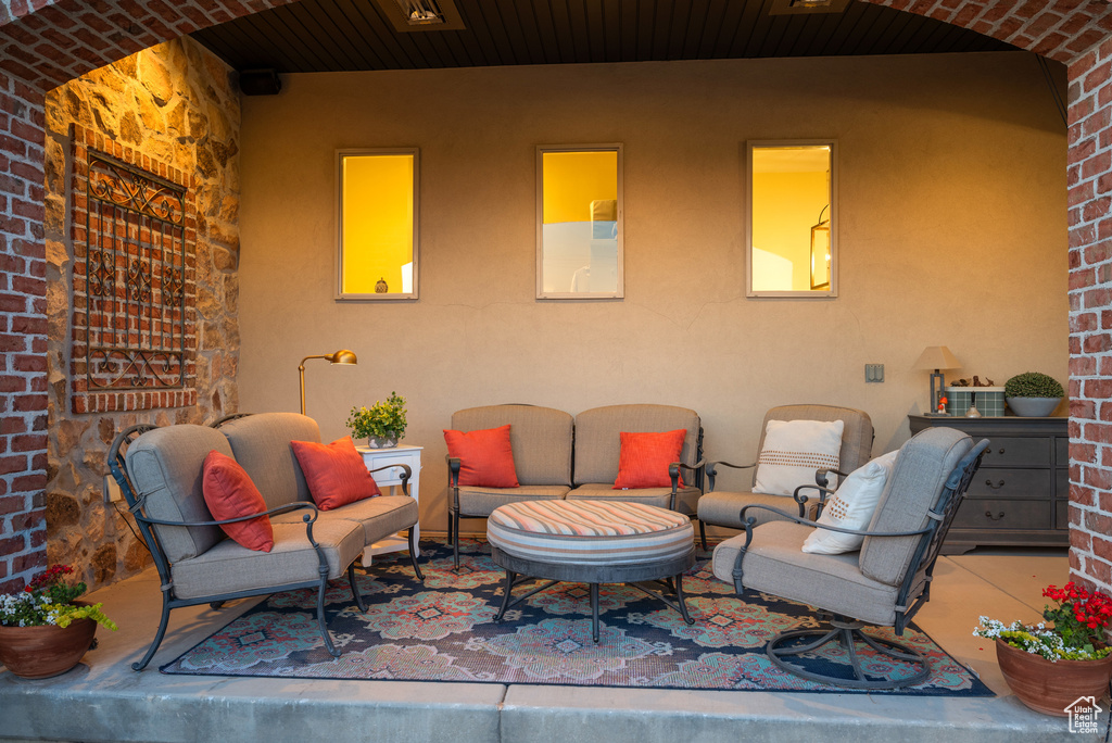 View of patio with an outdoor hangout area
