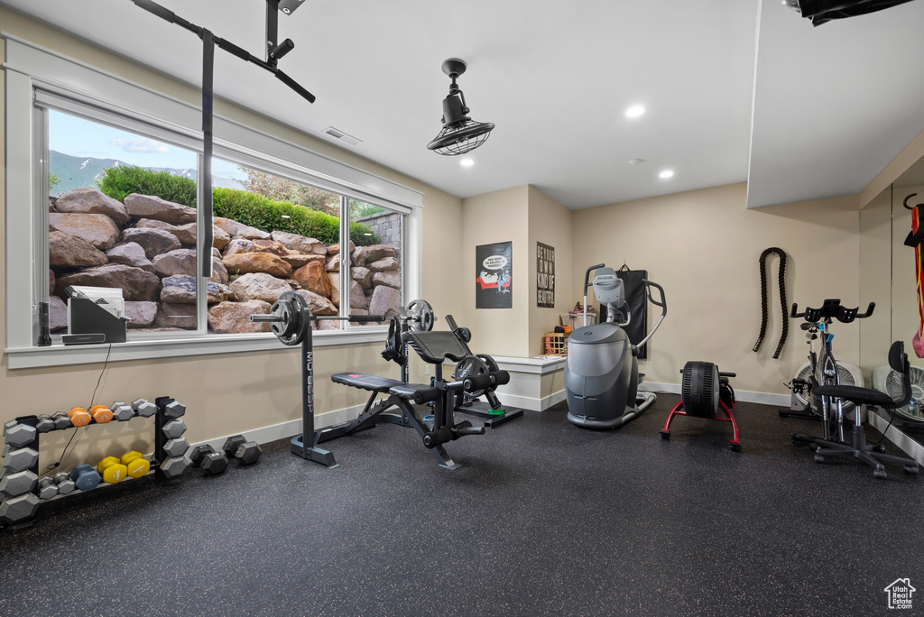 Workout area featuring baseboards and recessed lighting