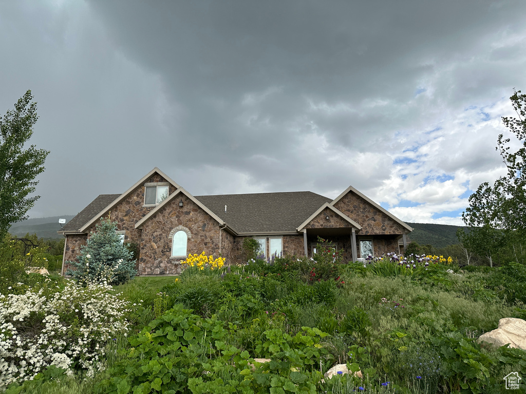 View of front of house featuring stone siding