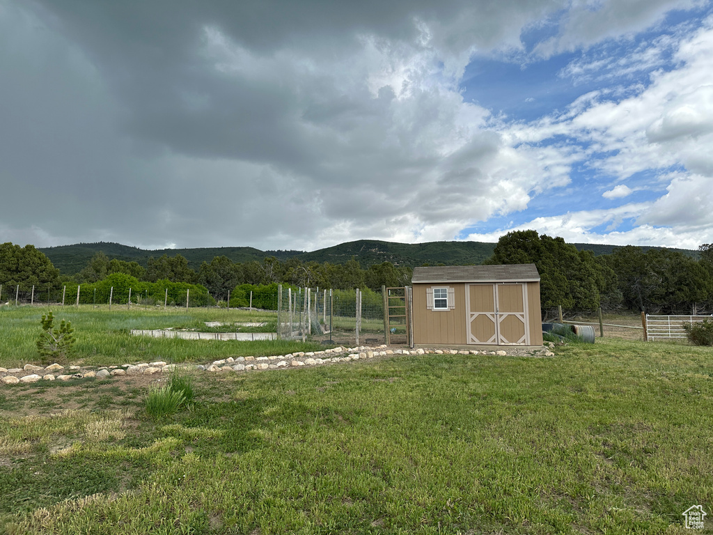 View of yard with a mountain view and a forest view