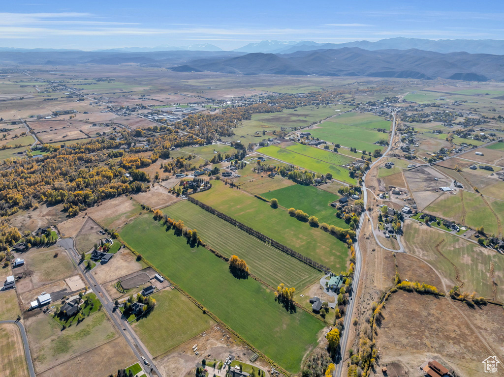 Aerial overview of property's location with mountains and rural landscape