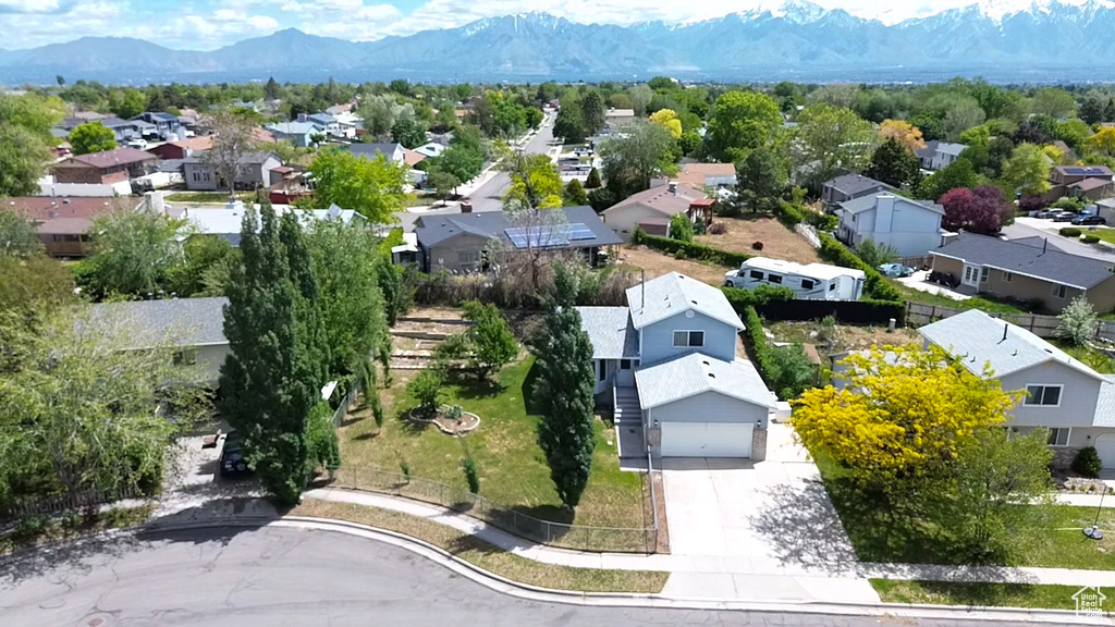 Aerial view of residential area featuring mountains