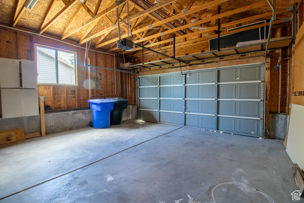 Garage featuring a garage door opener