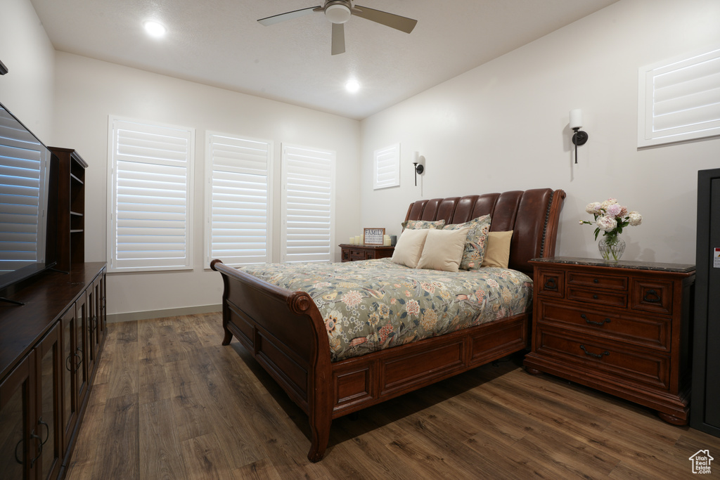 Bedroom featuring dark wood finished floors, a ceiling fan, and recessed lighting