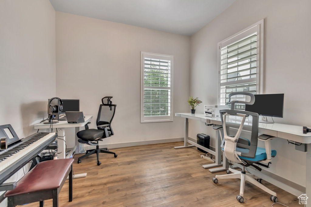 Home office with wood finished floors