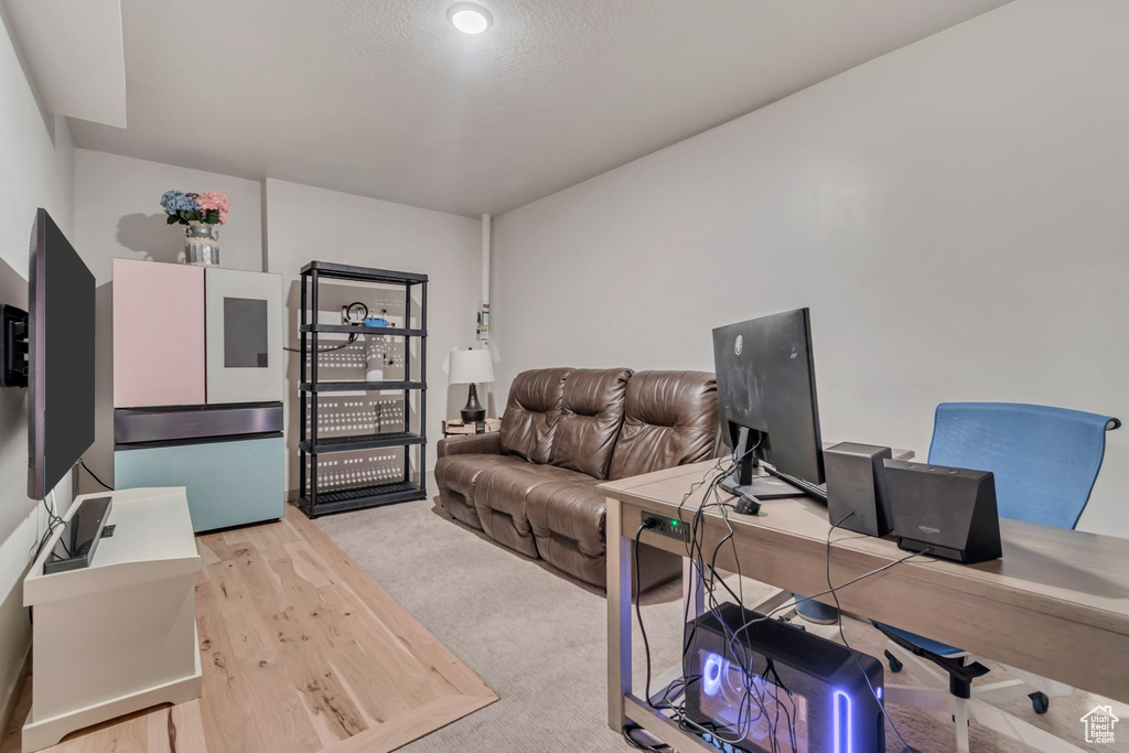 Home office featuring wood finished floors