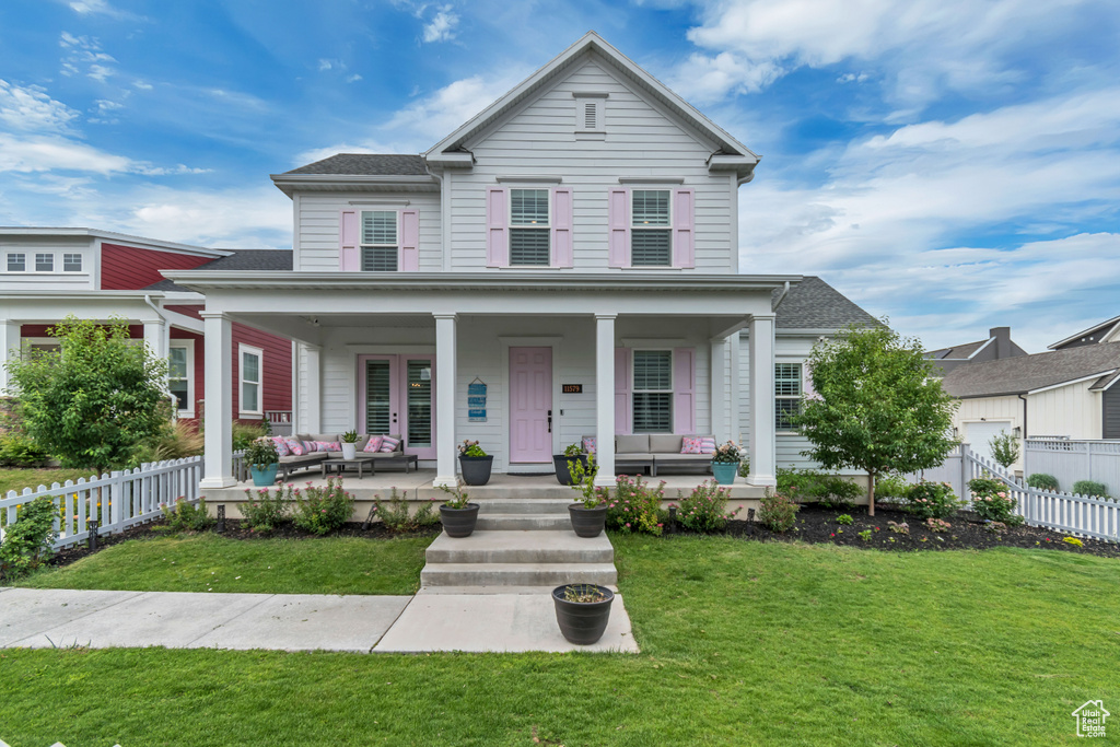 View of front of house featuring outdoor lounge area and a porch