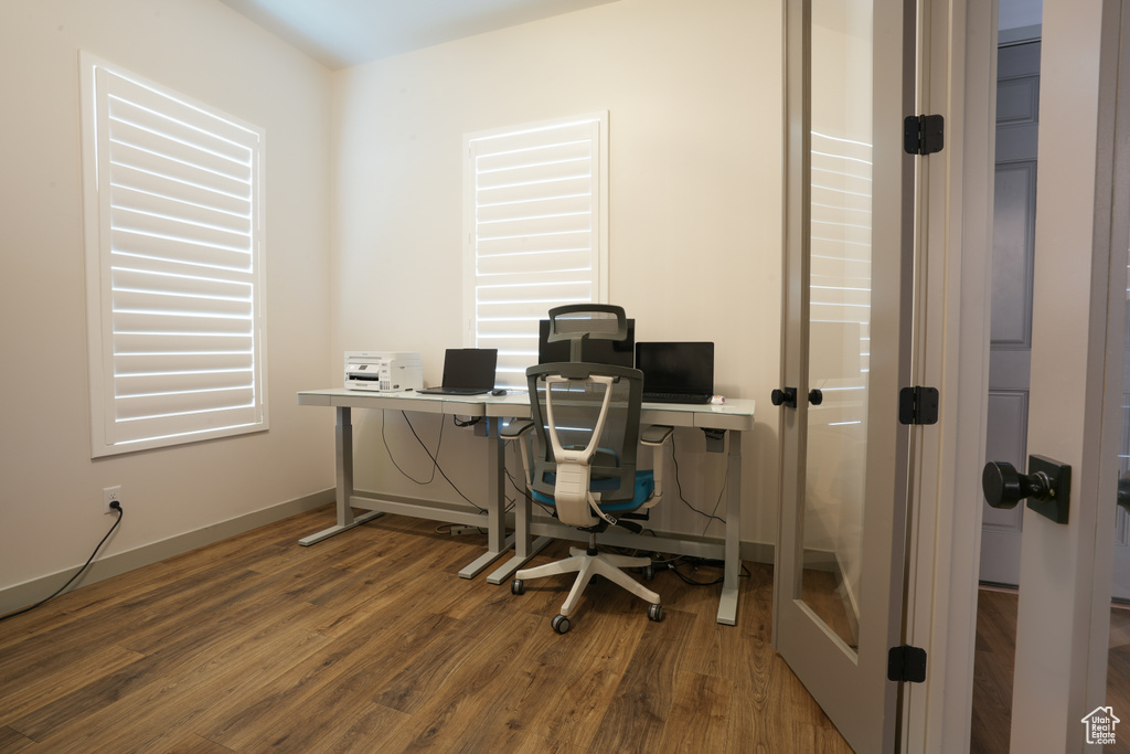 Office featuring wood finished floors and baseboards