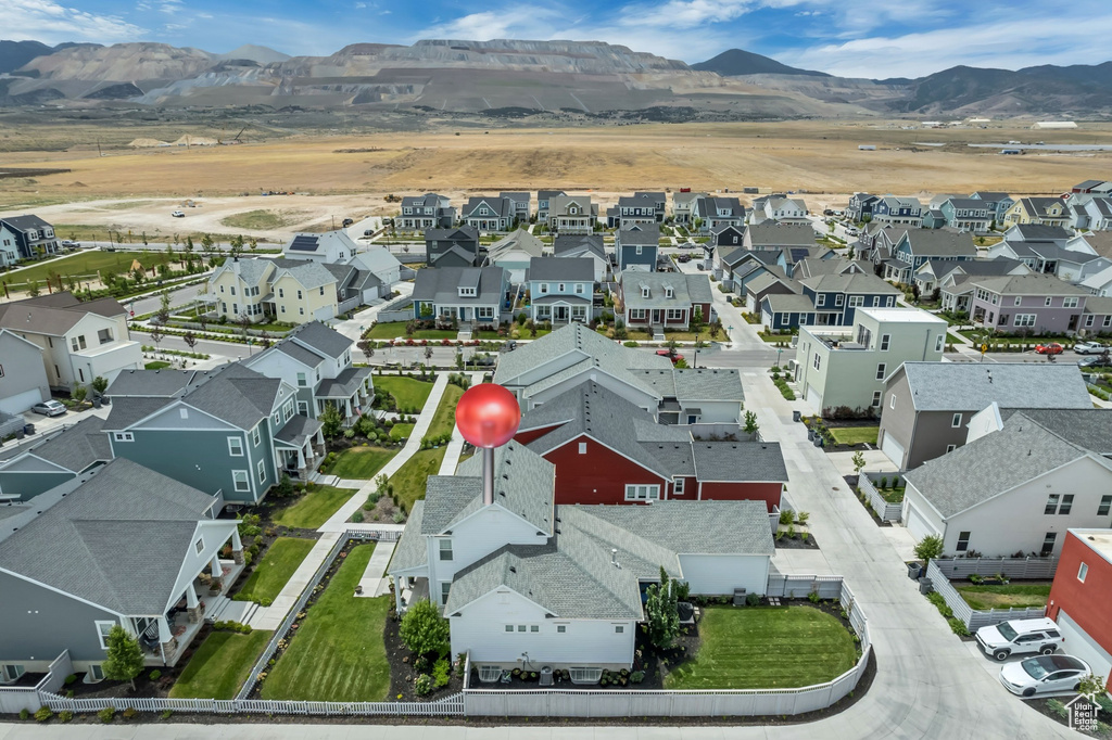 Aerial perspective of suburban area featuring a mountain backdrop