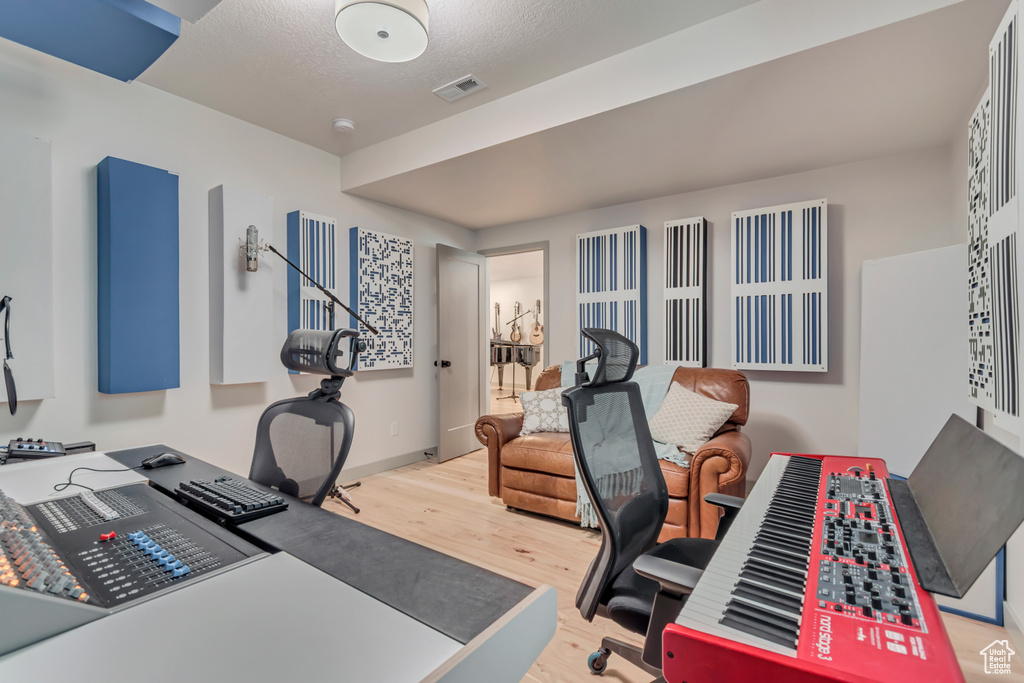Office with wood finished floors