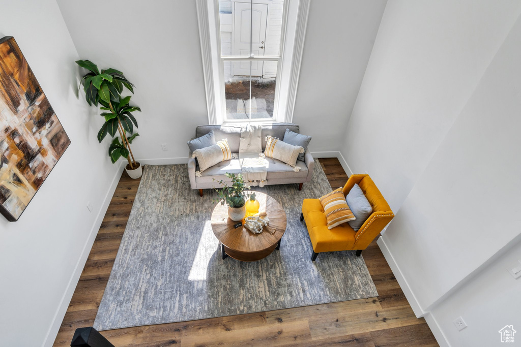 Living area featuring baseboards and wood finished floors
