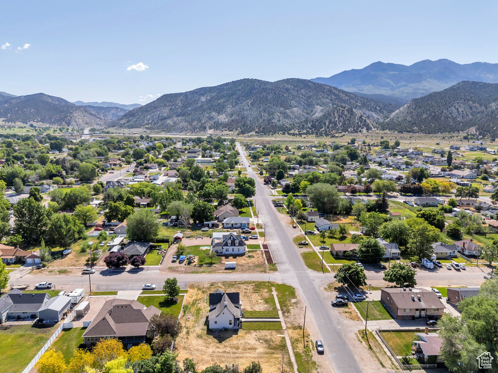 Aerial perspective of suburban area with a mountainous background