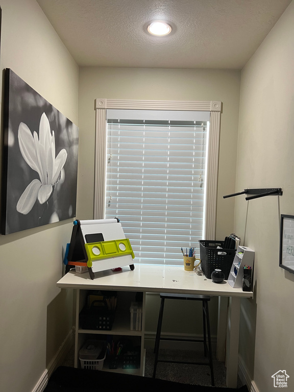 Office space with baseboards, recessed lighting, and a textured ceiling