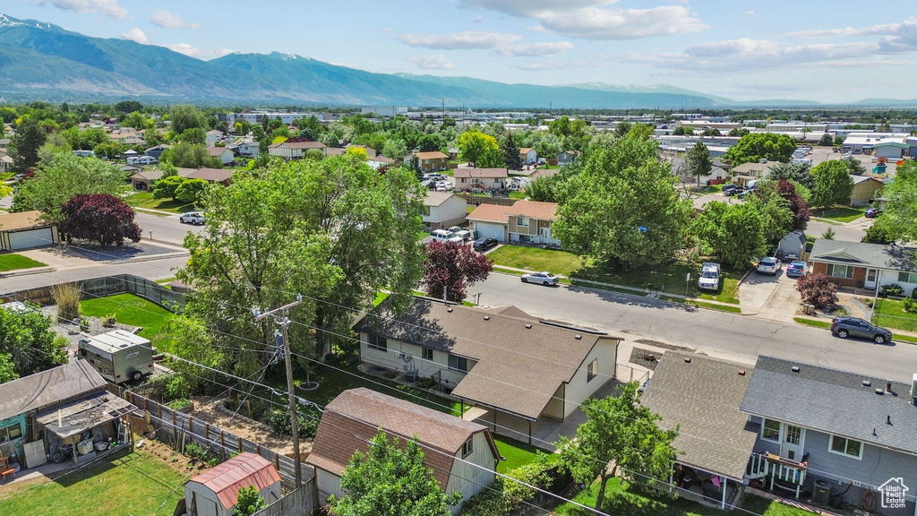Aerial view of residential area featuring a mountainous background