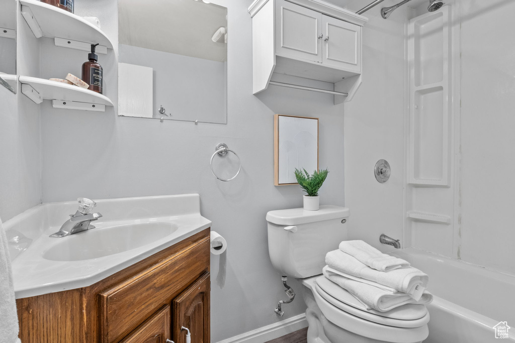 Full bathroom with vanity, toilet, and tub / shower combination