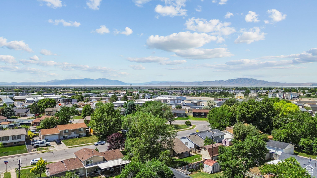 Aerial perspective of suburban area with a mountain backdrop