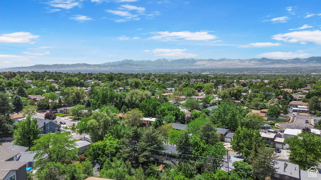 Aerial perspective of suburban area featuring a mountain backdrop