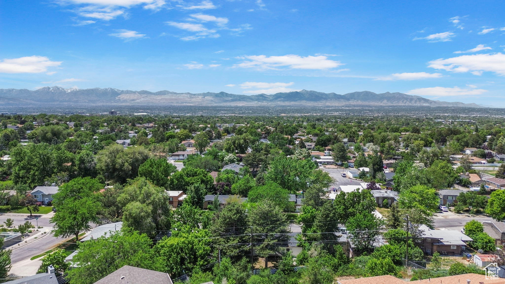 Aerial view of residential area featuring a mountainous background