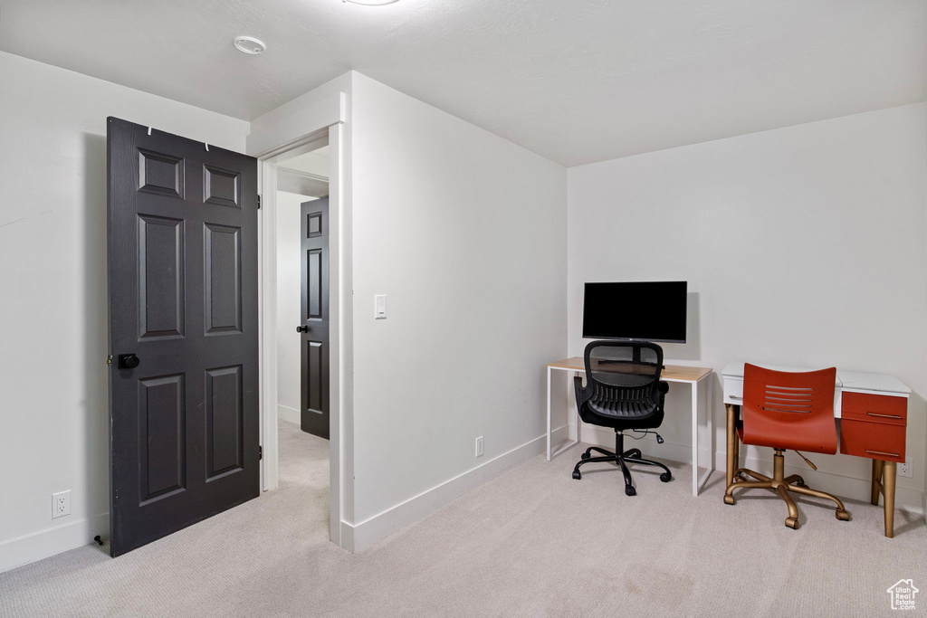 Office with carpet floors and baseboards