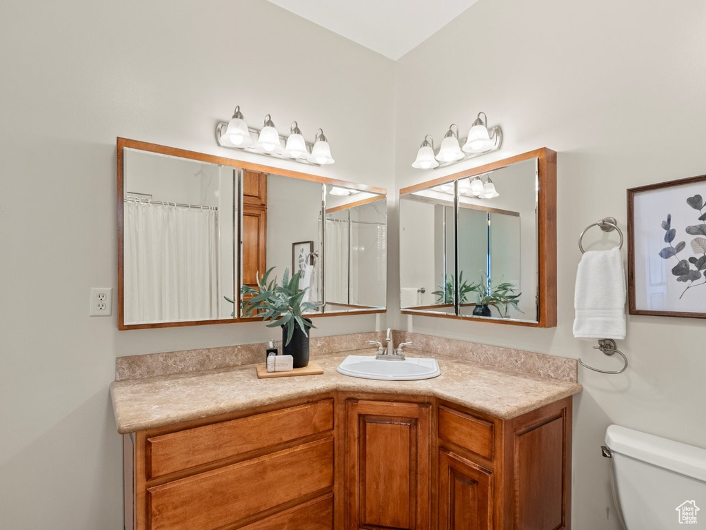 Full bathroom featuring vanity and toilet