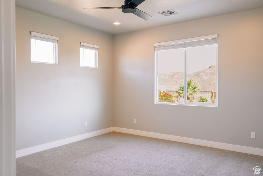 Unfurnished room with a ceiling fan, baseboards, light colored carpet, and recessed lighting
