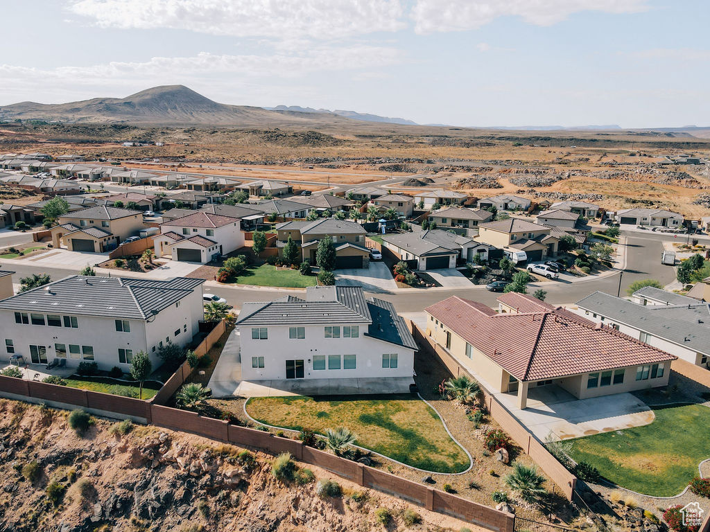 Aerial view of residential area with a mountainous background