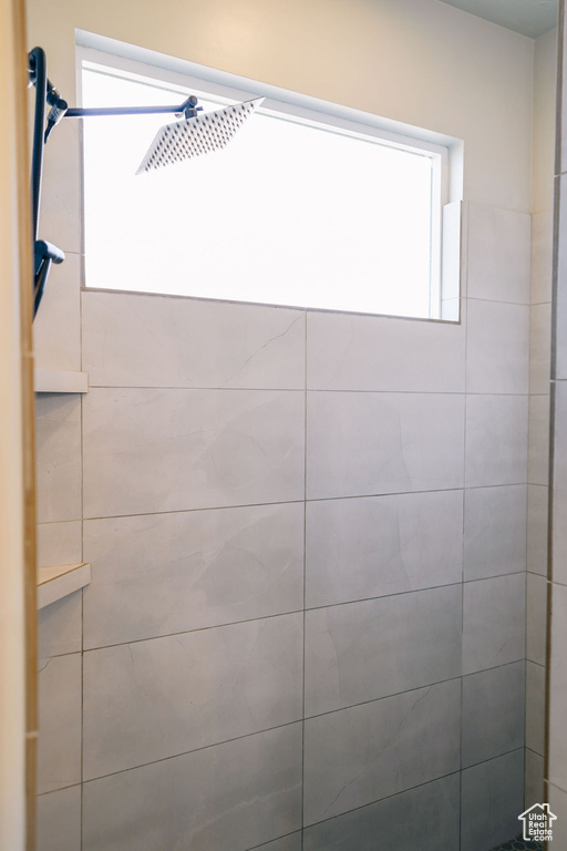 Full bathroom featuring tiled shower