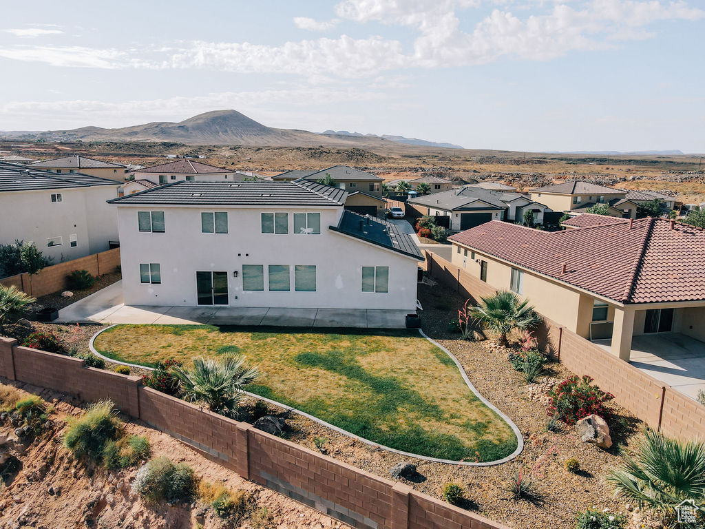 Aerial view of residential area featuring mountains