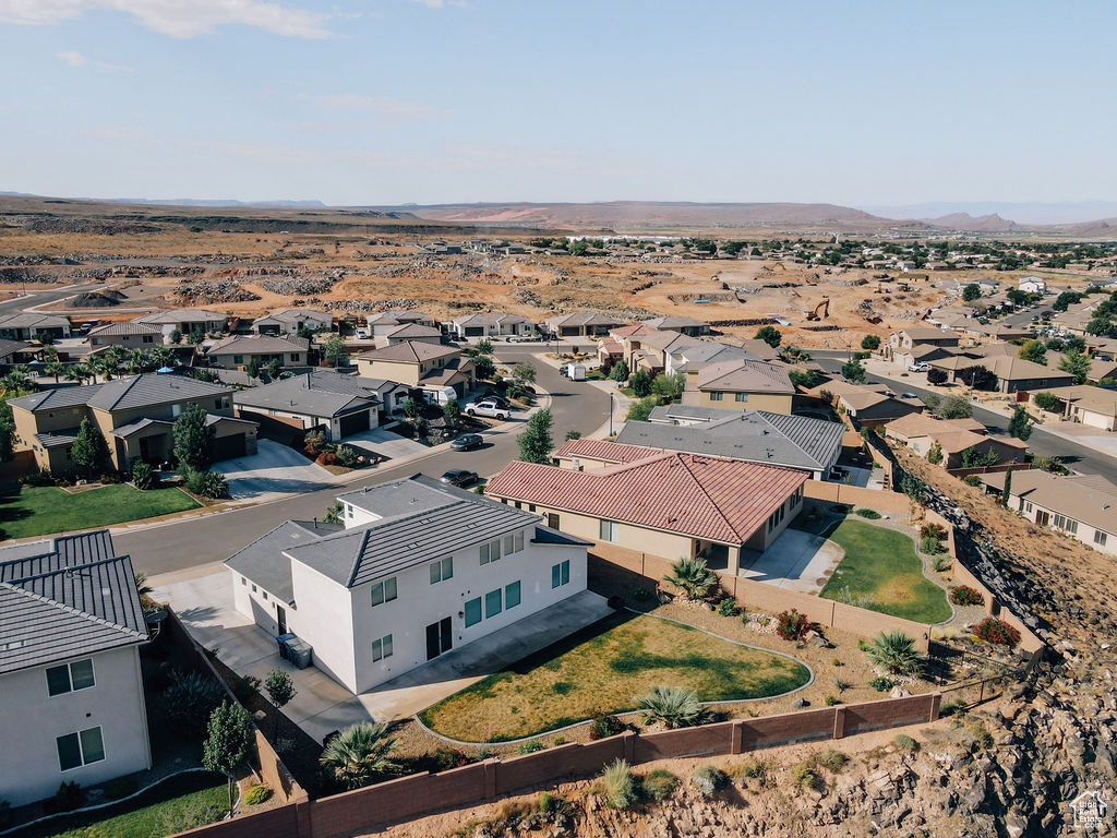 Aerial view of residential area featuring mountains