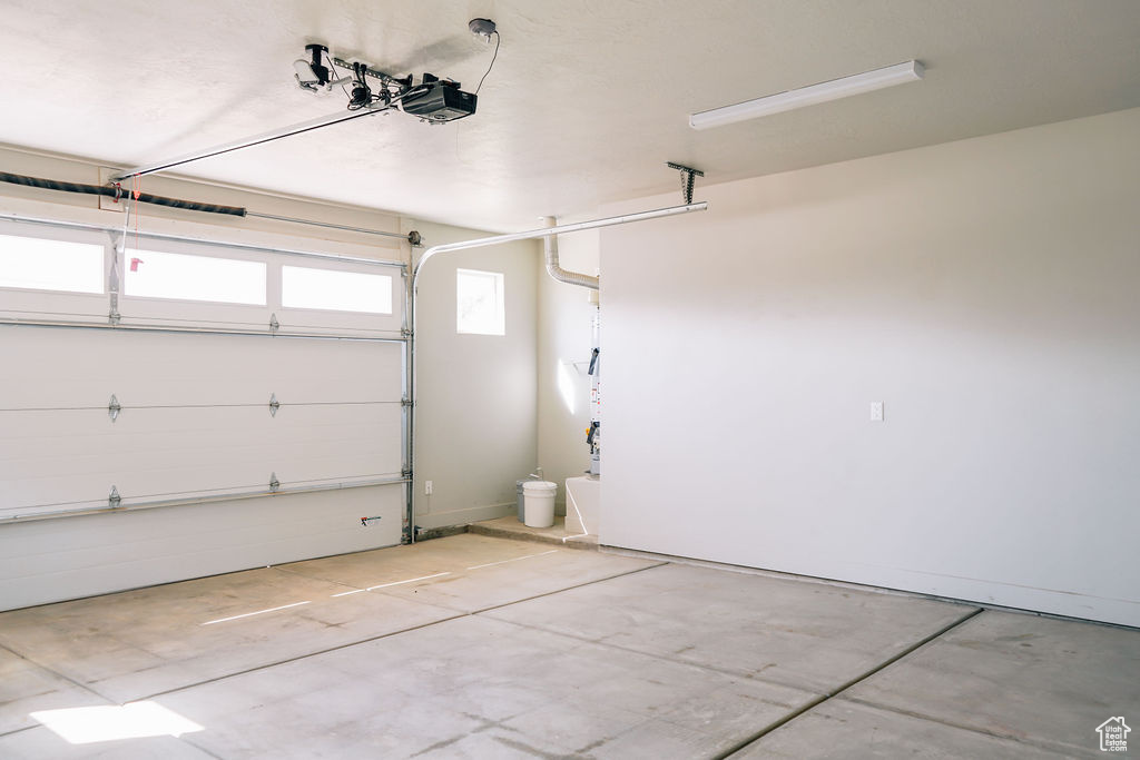 Garage featuring a garage door opener