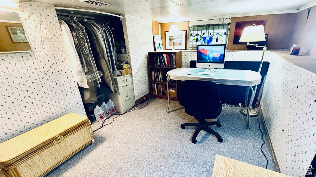 Home office featuring carpet floors and wallpapered walls