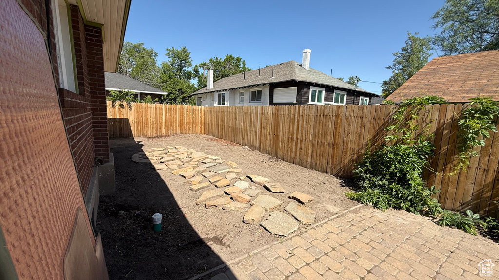 Fenced backyard featuring a patio area