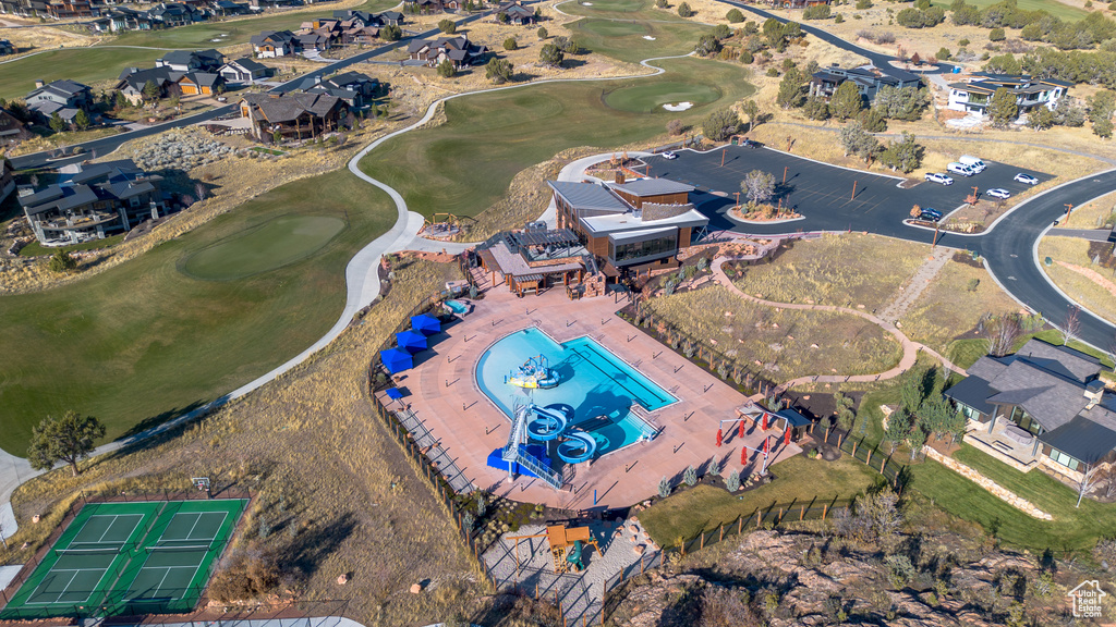 Aerial view of property's location with a golf club