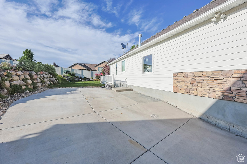View of property exterior with a patio