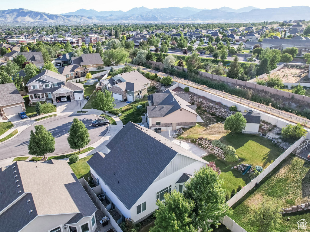 Aerial view of residential area featuring a mountain backdrop