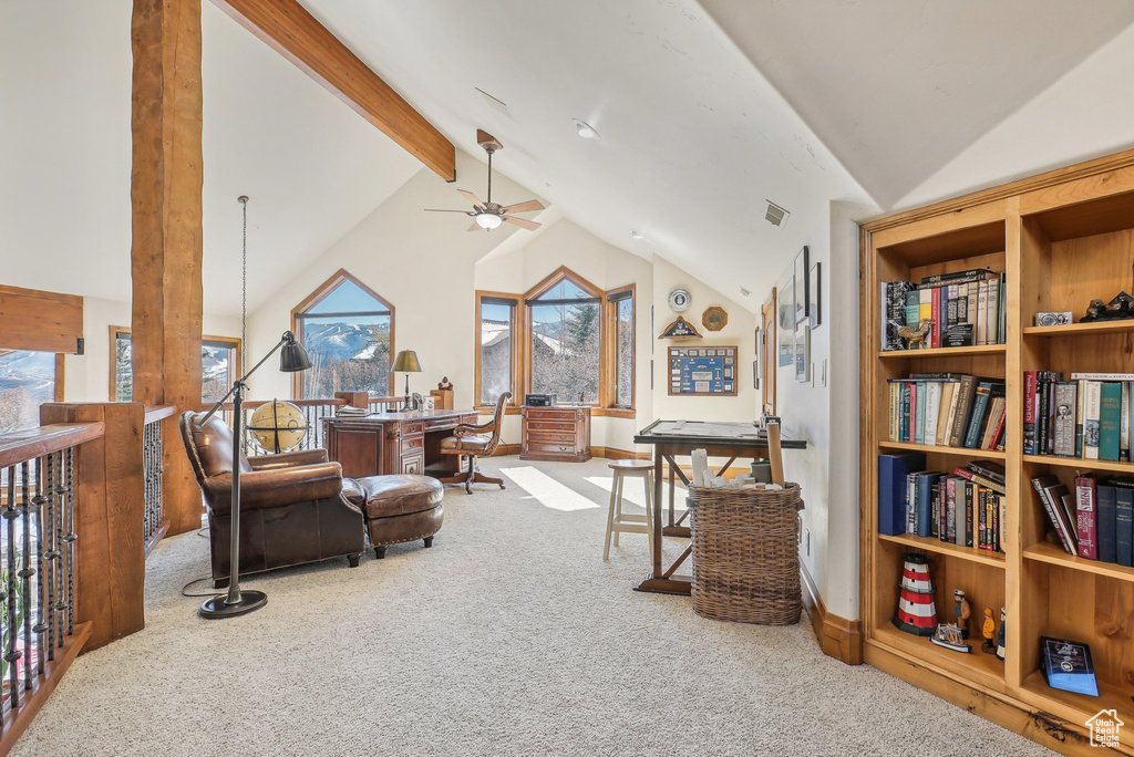 Sitting room featuring carpet flooring, a desk, ceiling fan, and baseboards