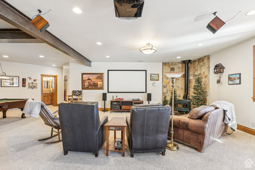 Carpeted home theater room featuring a wood stove, recessed lighting, pool table, and baseboards