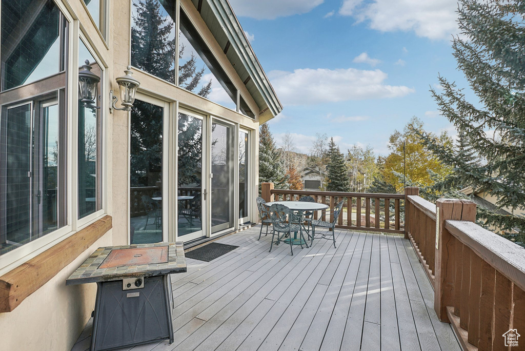 Wooden terrace with outdoor dining area