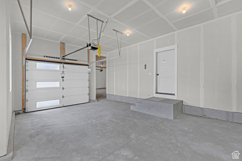 Garage featuring a garage door opener