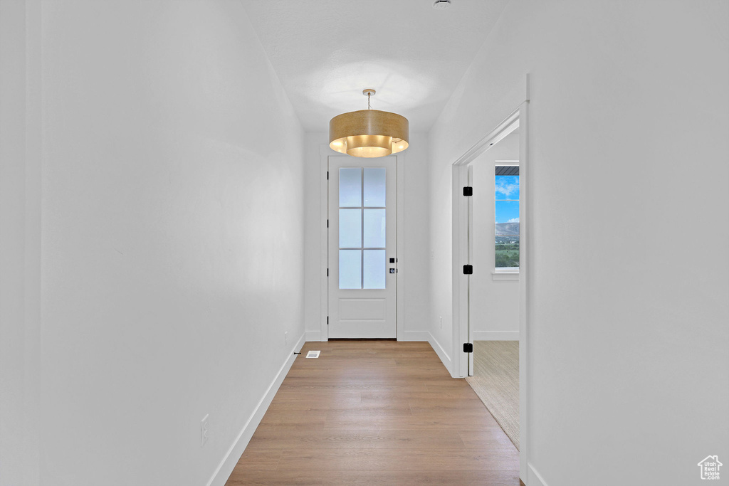 Entryway featuring wood finished floors and baseboards